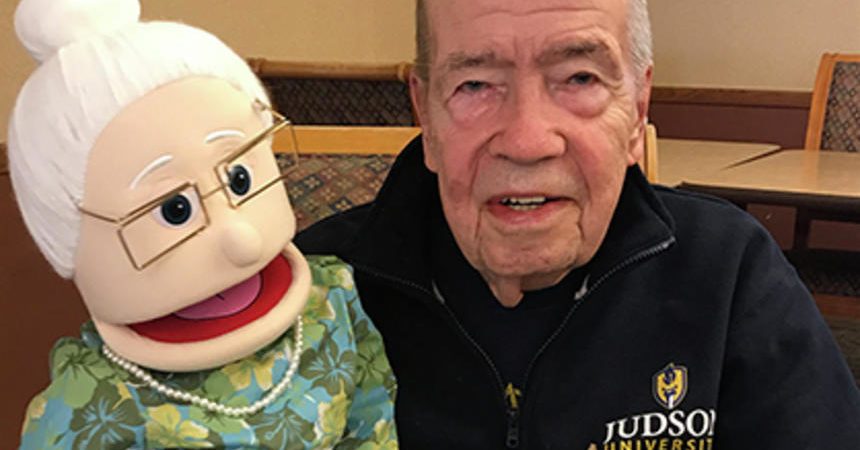 Craig Stewart poses with his reminiscence program puppet, Carla, at Ecumen Meadows in Worthington.
