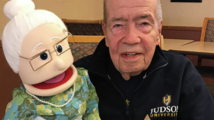 Craig Stewart poses with his reminiscence program puppet, Carla, at Ecumen Meadows in Worthington.