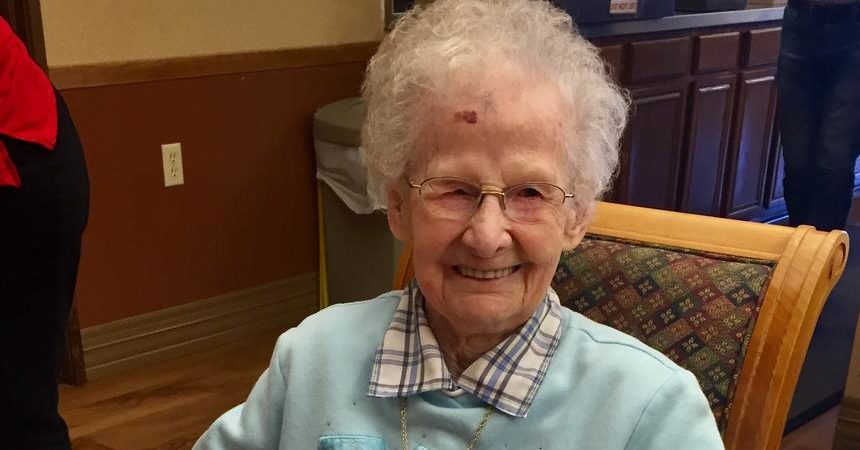 Lecil Arends poses with her 105th birthday cake at Ecumen Meadows in Worthington.