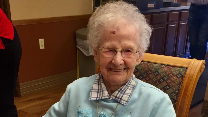 Lecil Arends poses with her 105th birthday cake at Ecumen Meadows in Worthington.