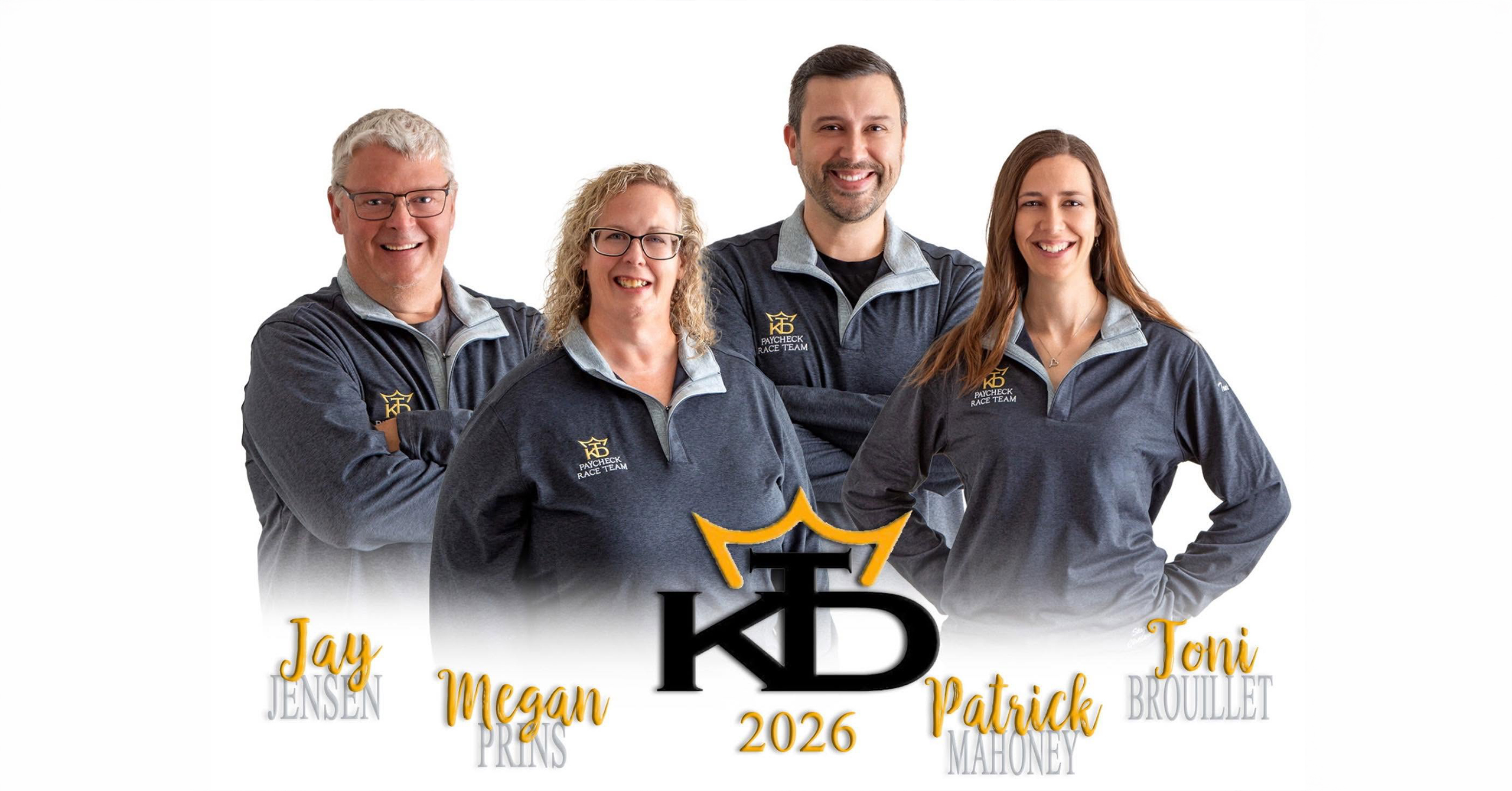 Four people in gray quarter-zip pullovers stand together
